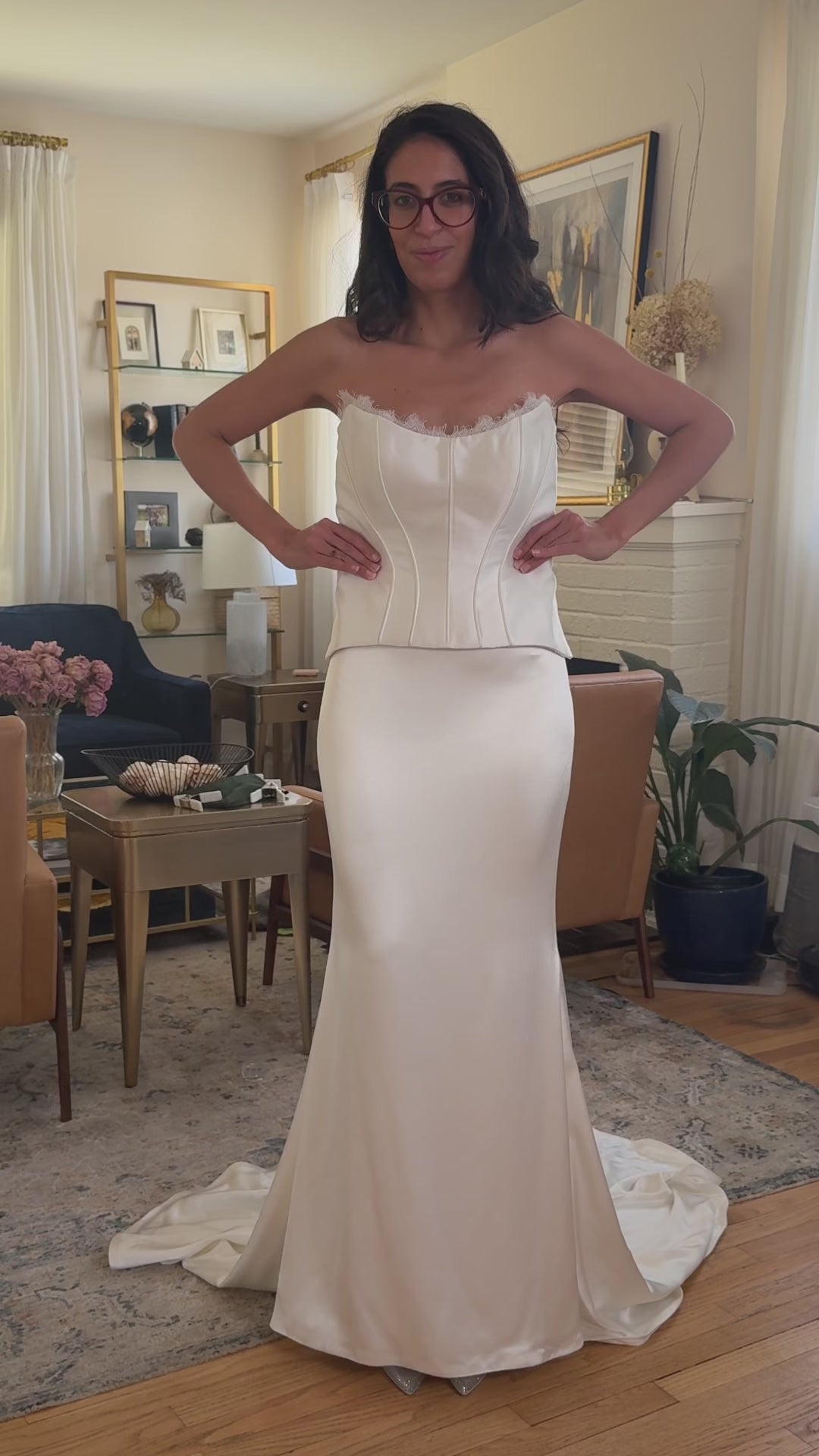 Load video: bride in white dress shows before versus after using dress clamps